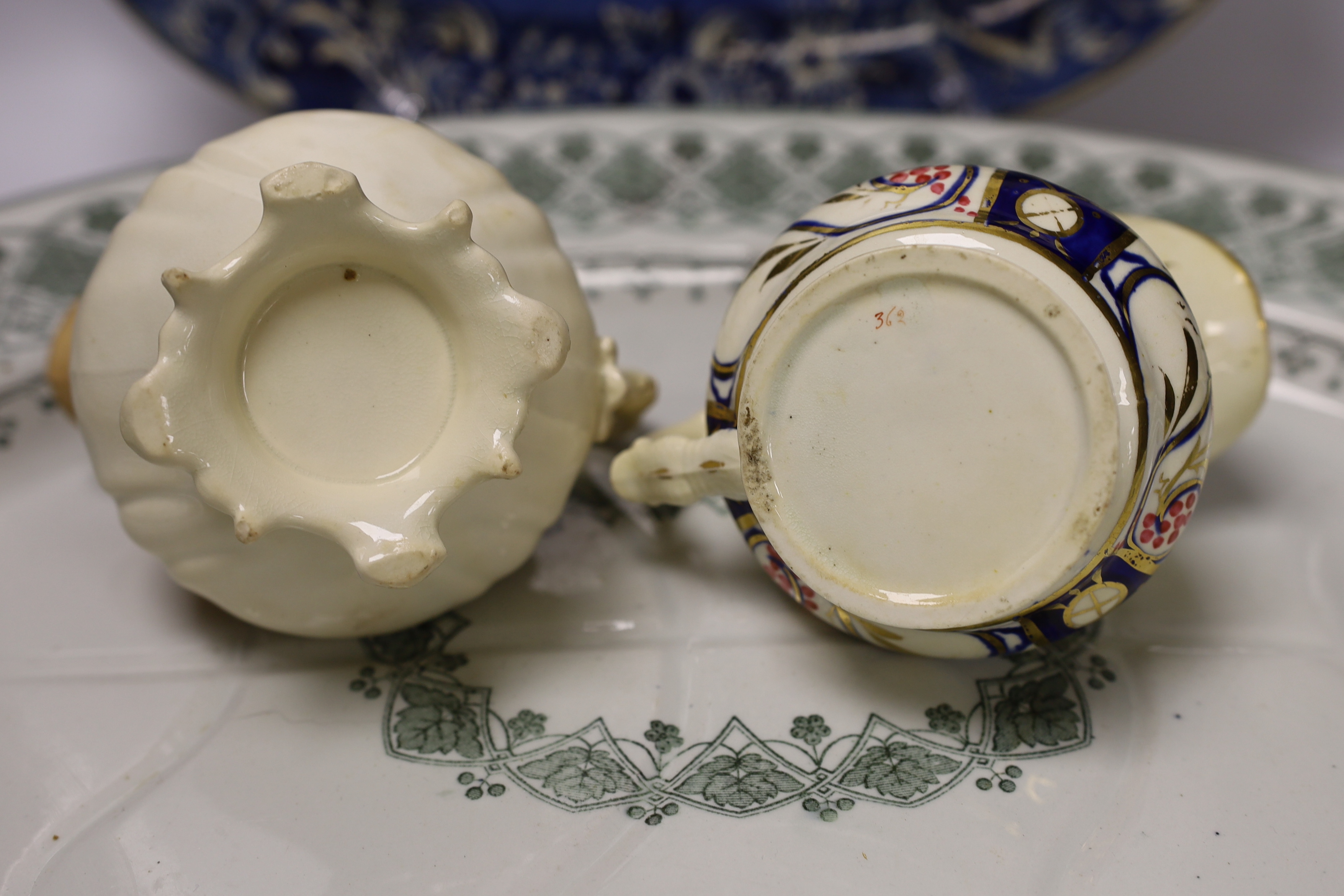 A Davenport meat dish, another and two jugs, largest 53cm
